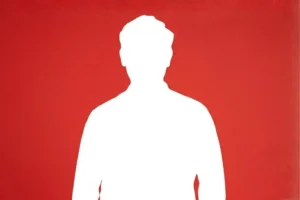 Silhueta branca preenchida de um homem de meia-idade posando de frente com a mão esquerda no bolso, sobre um fundo vermelho sólido e vibrante. Foto genérica de homem.