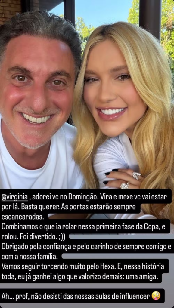 Luciano Huck sorrindo ao lado de Virginia Fonseca, que aparece sorridente com cabelos loiros longos e anéis em destaque na mão esquerda. Na parte inferior da imagem, há um print de texto de um Story do Instagram onde Luciano agradece a participação dela no programa Domingão.